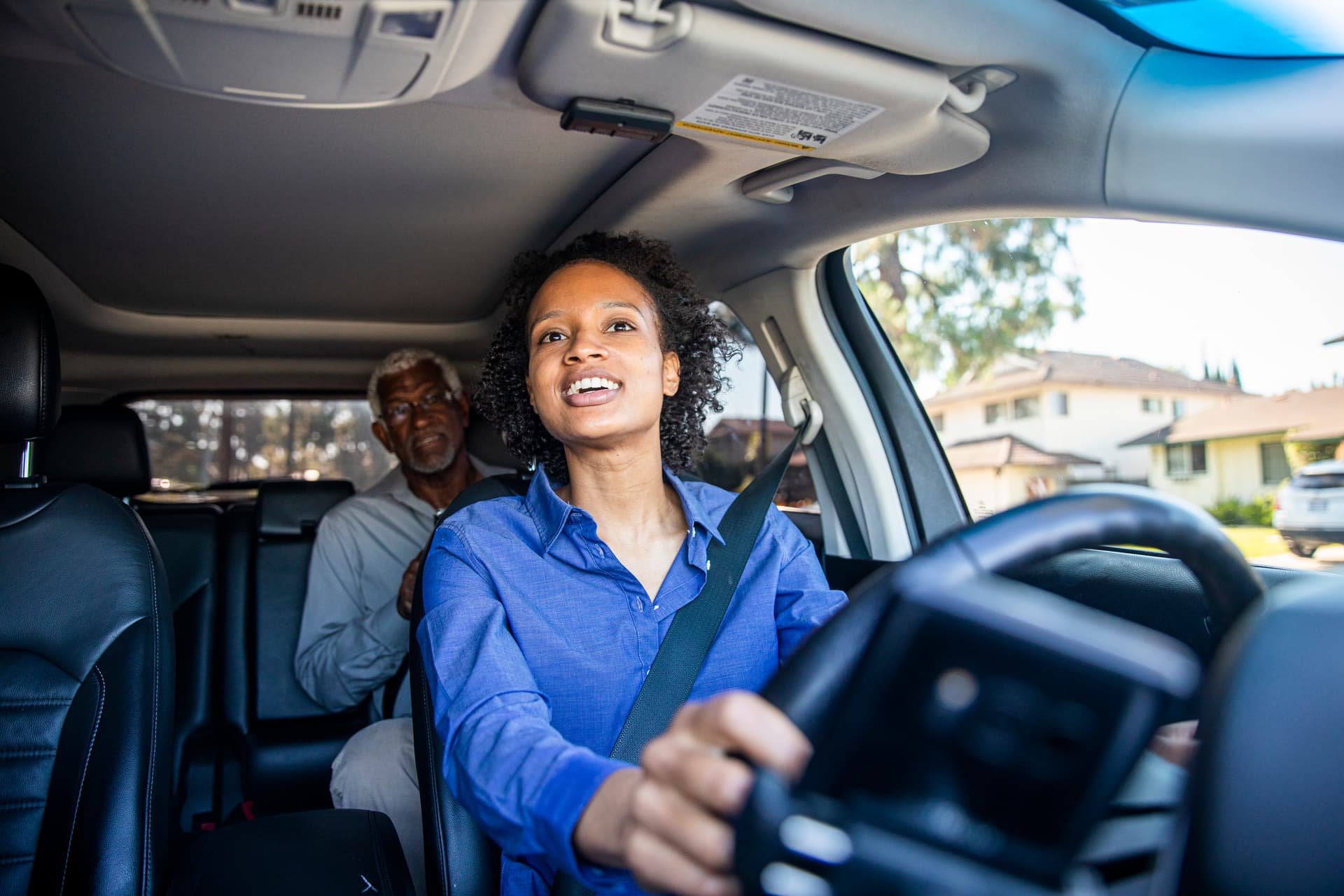 Driver smiling in car